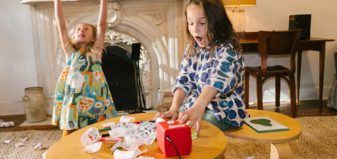 2 girls playing with the Stickerbox. 