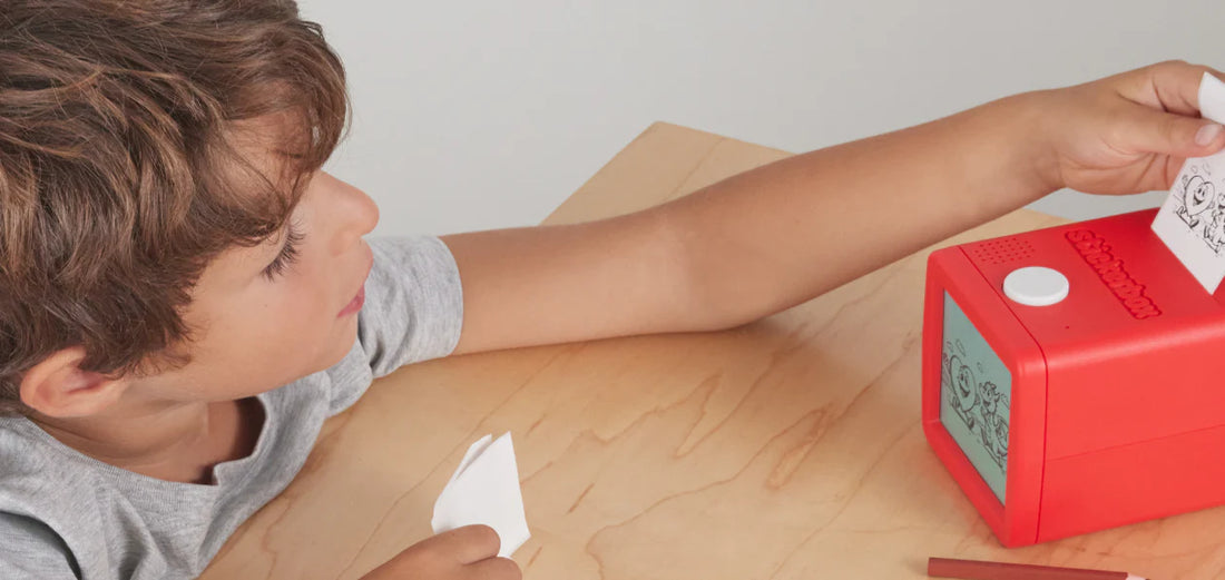 A child looking at printed stickers from Stickerbox.